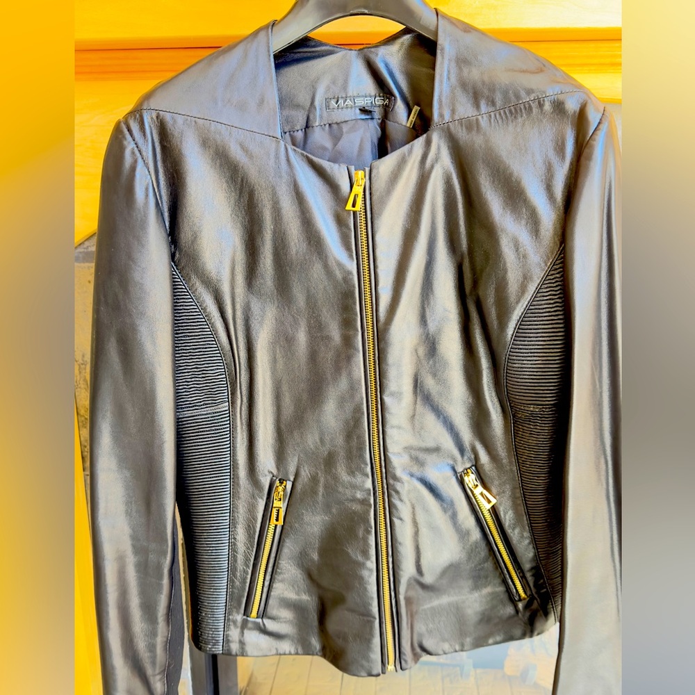 Via Spiga soft black leather jacket with gold hardware and ribbed accents.